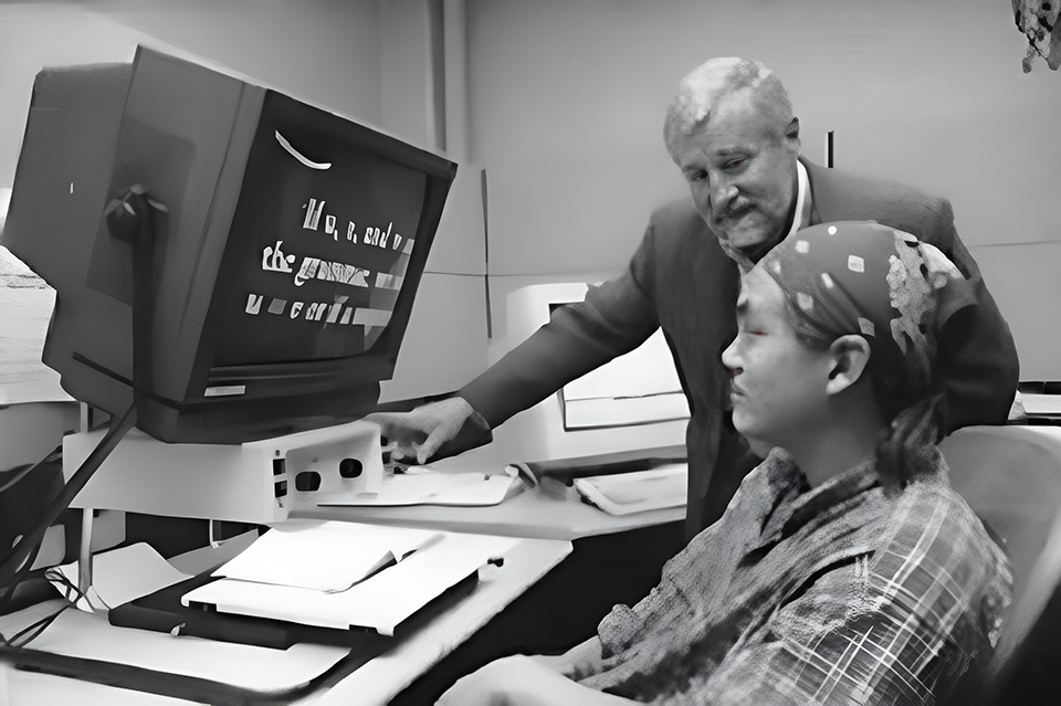 Jim Knox and a student looking at a magnified computer screen